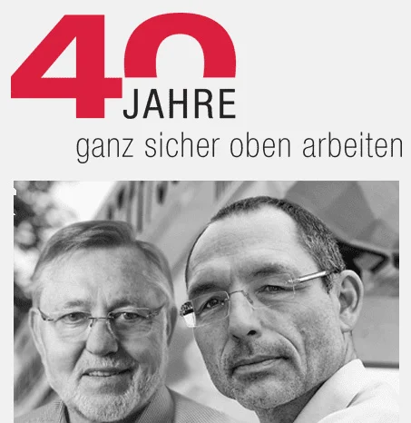 40 Jahre Logo und Slogan, darunter zwei Männer